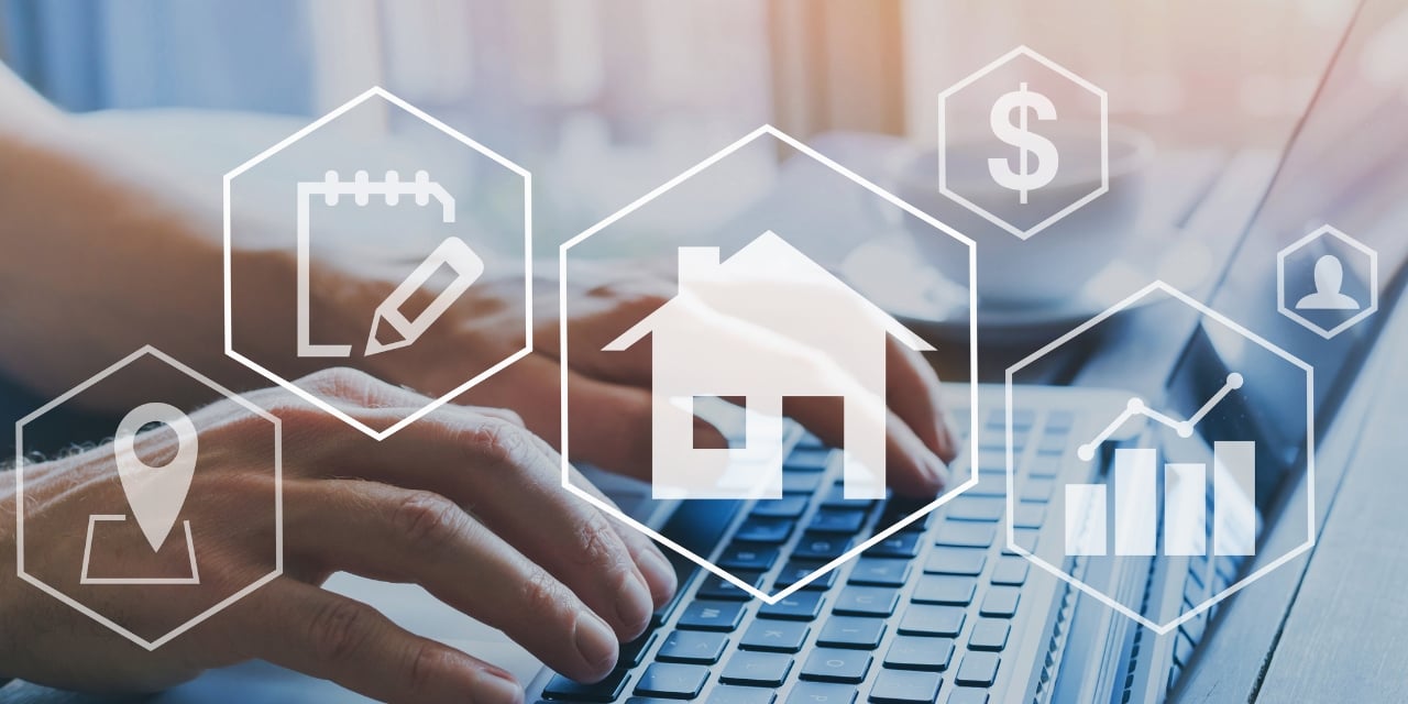 Hands typing on keyboard with various icons overlaid on image