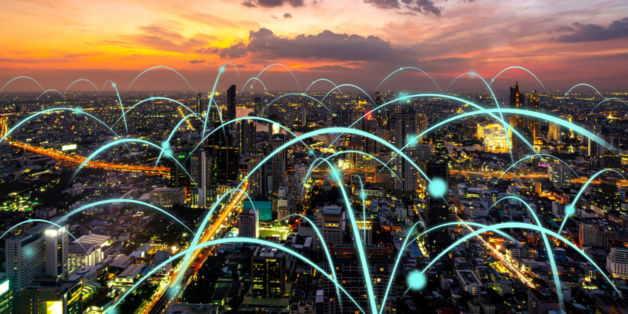 City arial view with an overlay of blue lines depicting connects between different areas of the city