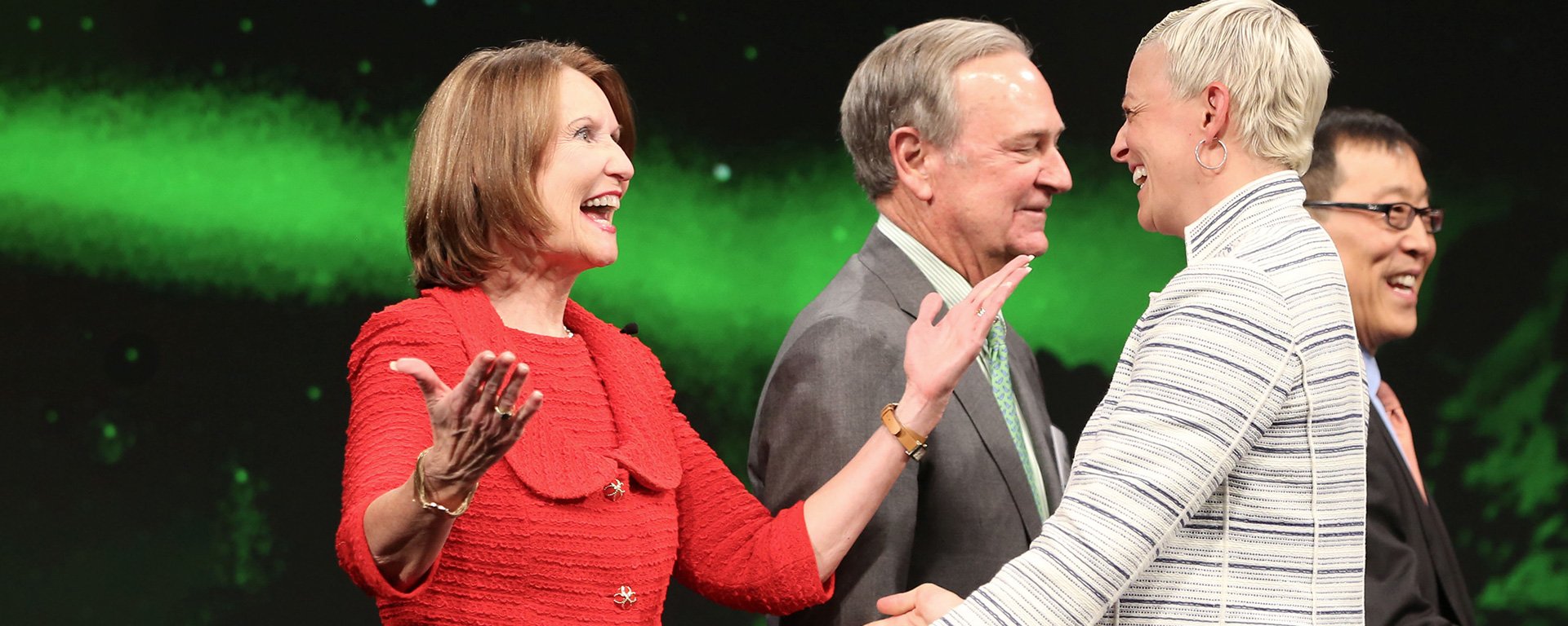 Mary Ellen Stanek congratulating an associate.